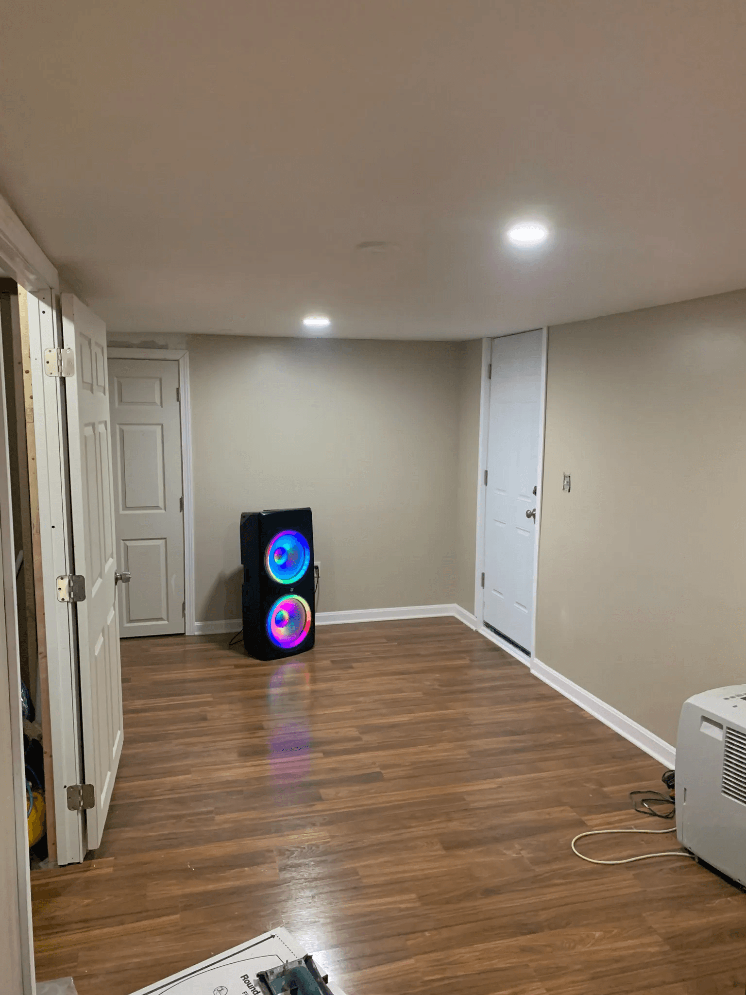 Finished Basement with a speaker on the ground