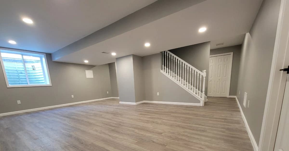 Newly Finished Basement, gray walls, hardwood floor.