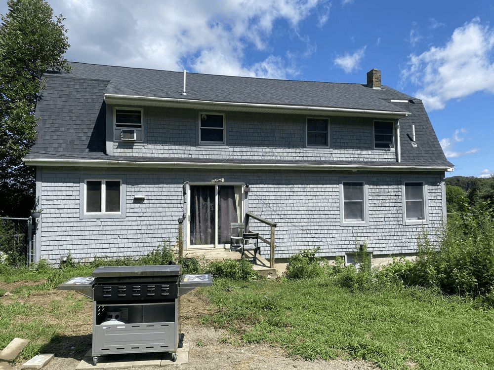 A blue house, getting ready to be painted